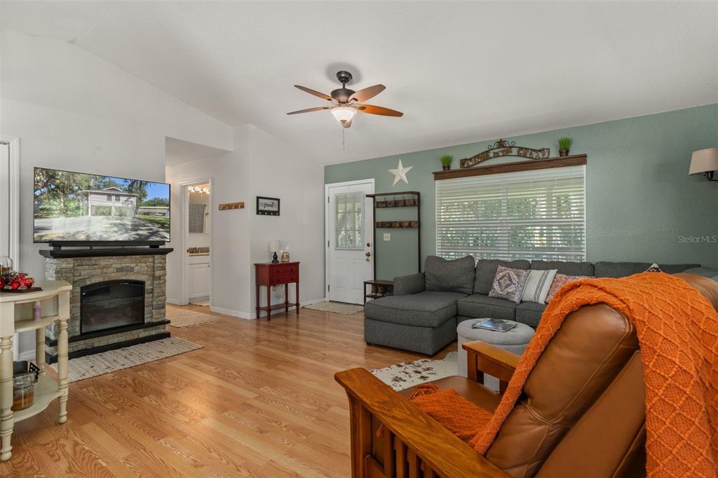5890 South Mason Creek Road Homosassa, FL 34448 - Photo 12 of 50 a living room with furniture and a fireplace