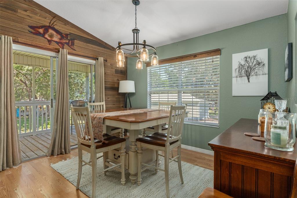 5890 South Mason Creek Road Homosassa, FL 34448 - Photo 13 of 50 a view of a dining room with furniture window and outside view