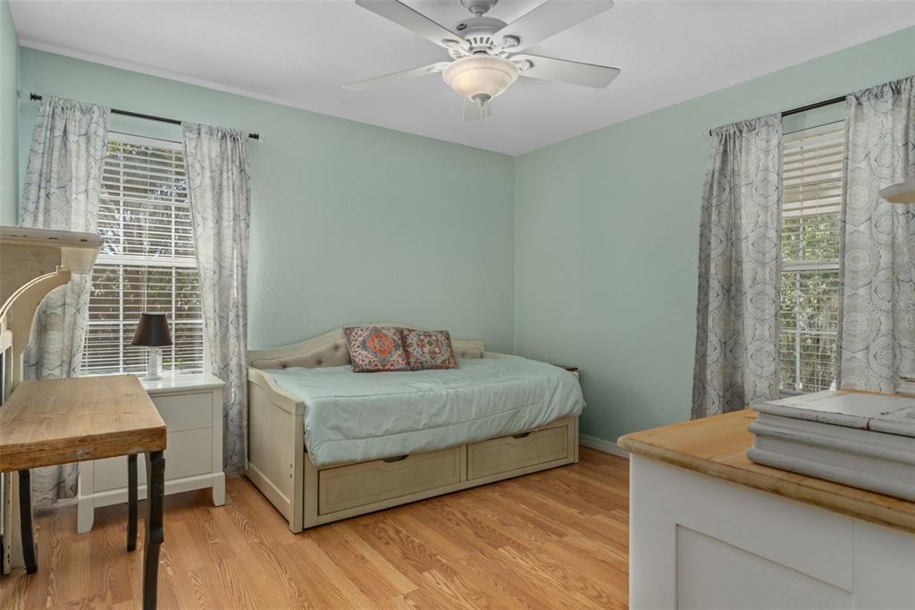 5890 South Mason Creek Road Homosassa, FL 34448 - Photo 22 of 50 a bedroom with a bed and a table