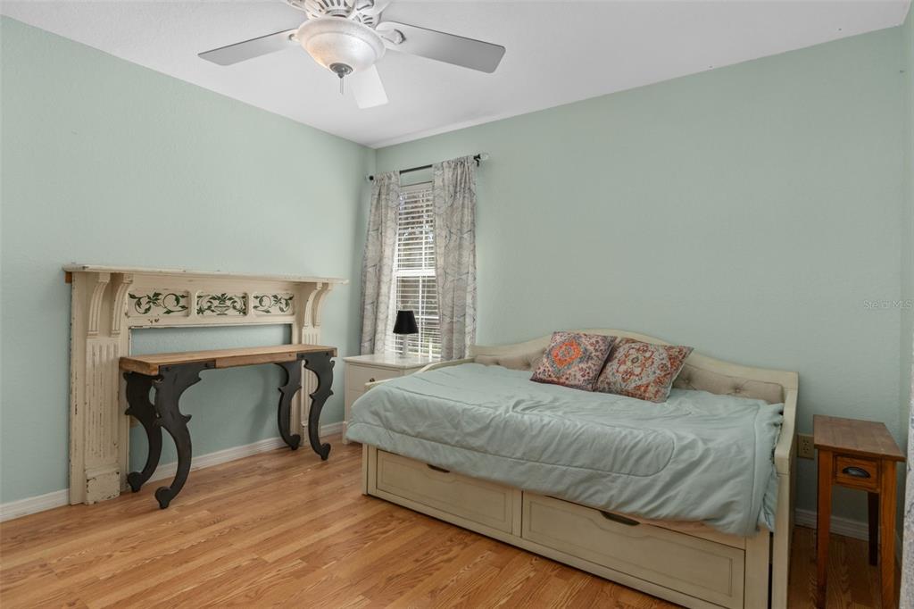 5890 South Mason Creek Road Homosassa, FL 34448 - Photo 23 of 50 a bedroom with a bed and a table