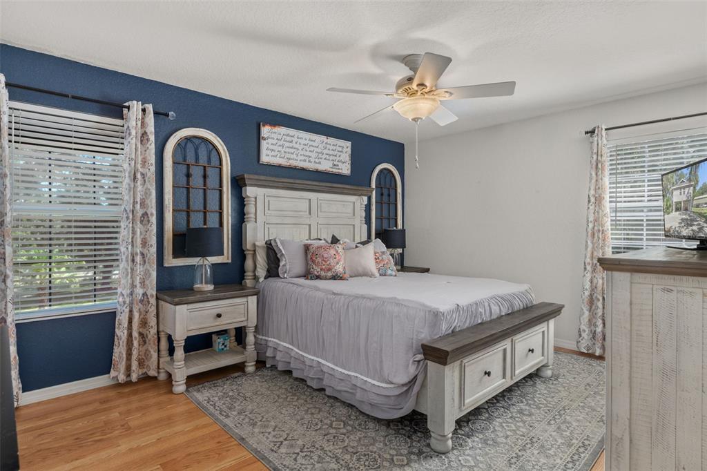 5890 South Mason Creek Road Homosassa, FL 34448 - Photo 24 of 50 a bed room with a bed and a chandelier