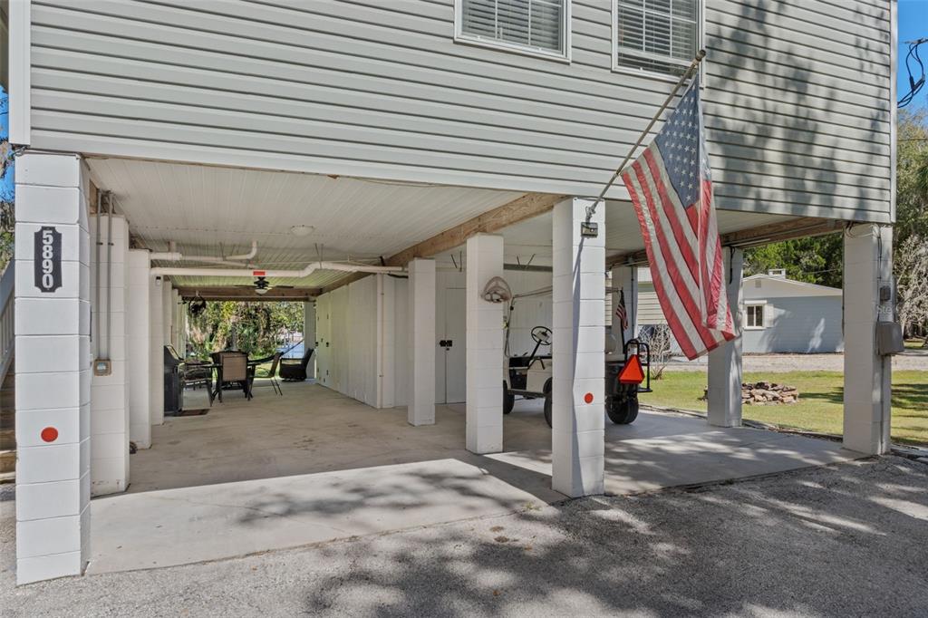 5890 South Mason Creek Road Homosassa, FL 34448 - Photo 31 of 50 a view of a house with a patio and a yard