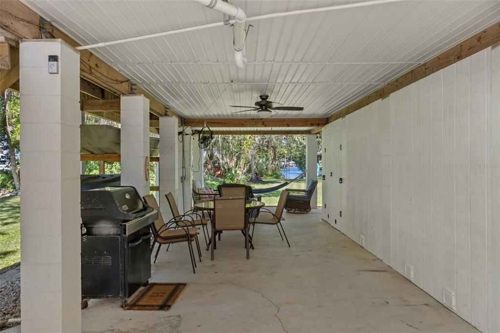 5890 South Mason Creek Road Homosassa, FL 34448 - Photo 32 of 50 a dining room with furniture and a floor to ceiling window