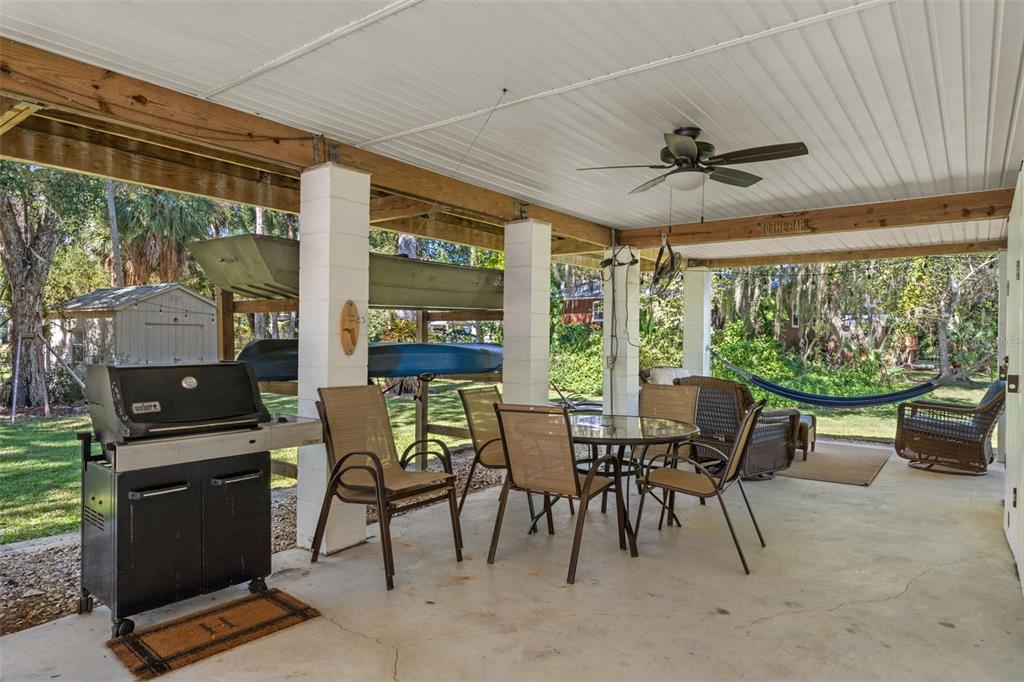 5890 South Mason Creek Road Homosassa, FL 34448 - Photo 33 of 50 a view of a dining room with furniture window and outside view