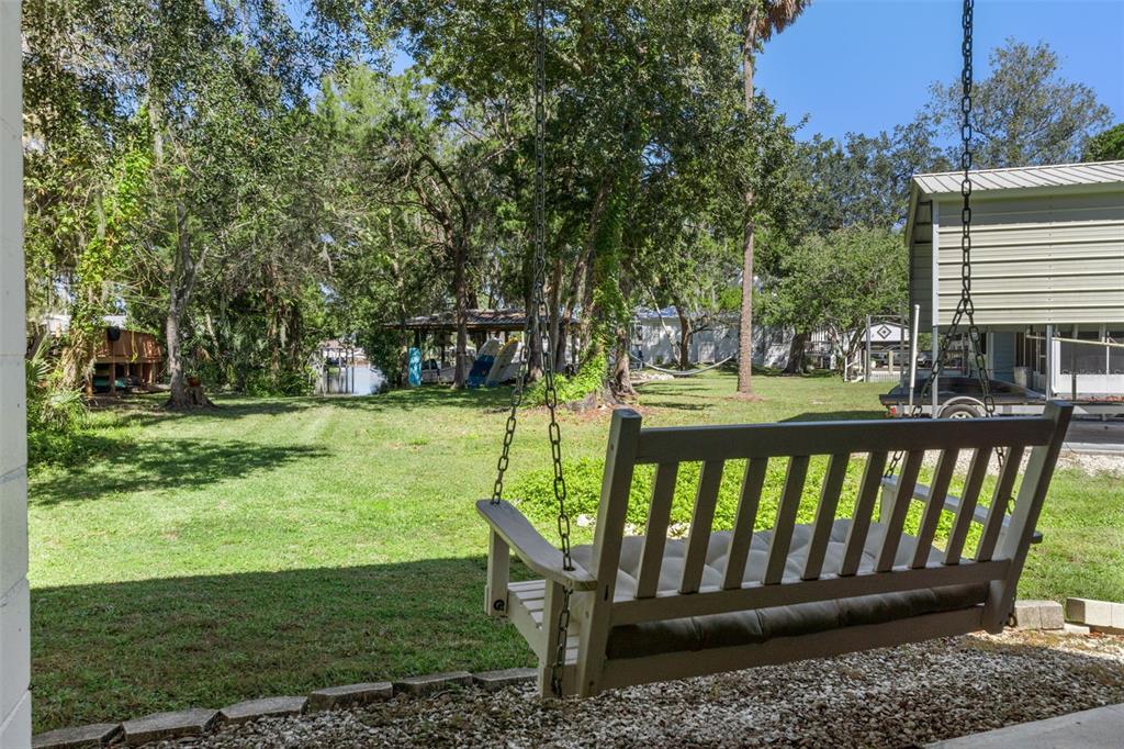 5890 South Mason Creek Road Homosassa, FL 34448 - Photo 37 of 50 a view of deck with a backyard and trees