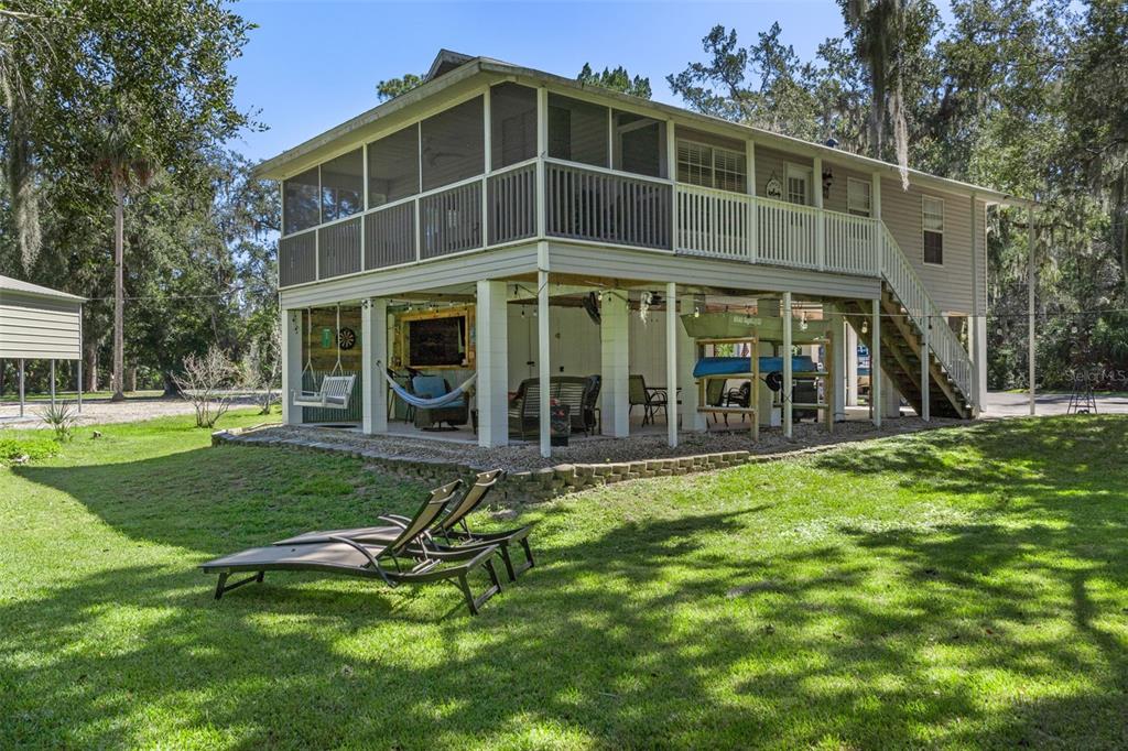 5890 South Mason Creek Road Homosassa, FL 34448 - Photo 4 of 50 a view of a house with a yard
