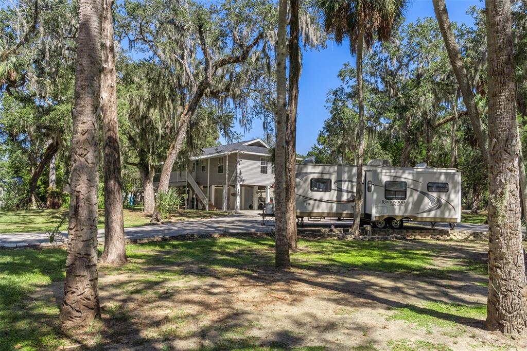 5890 South Mason Creek Road Homosassa, FL 34448 - Photo 41 of 50 a view of a house with a yard