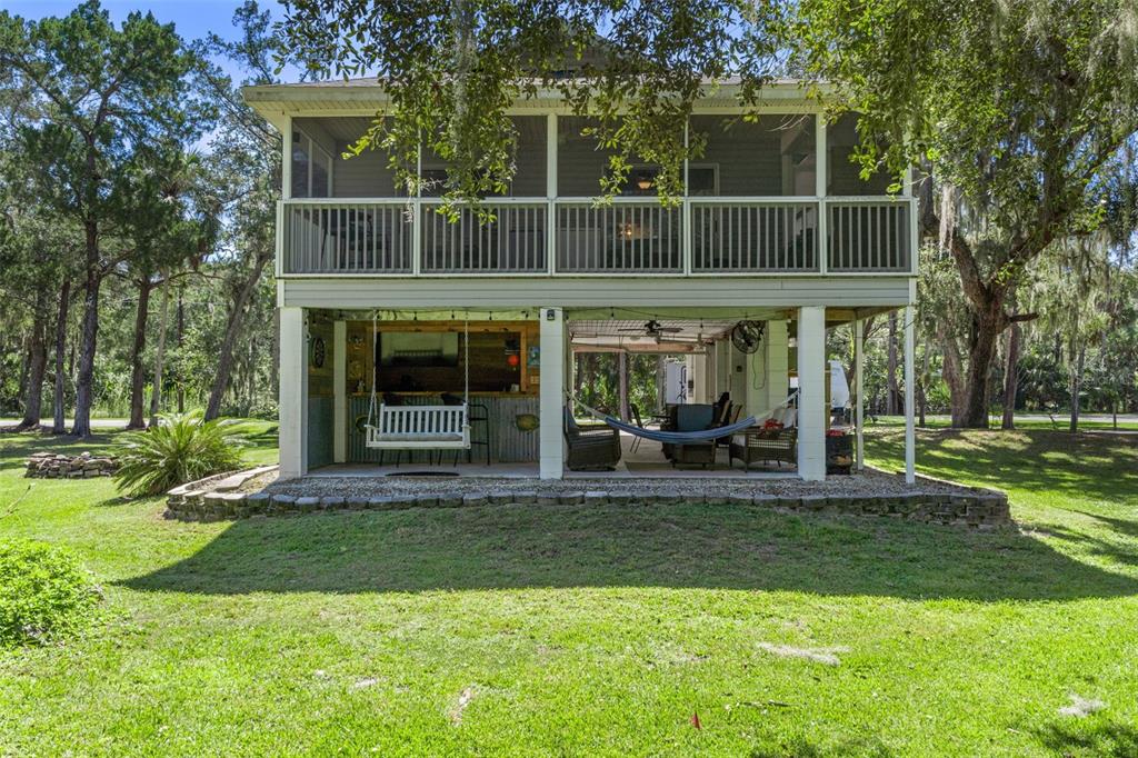 5890 South Mason Creek Road Homosassa, FL 34448 - Photo 5 of 50 a front view of a house with a yard