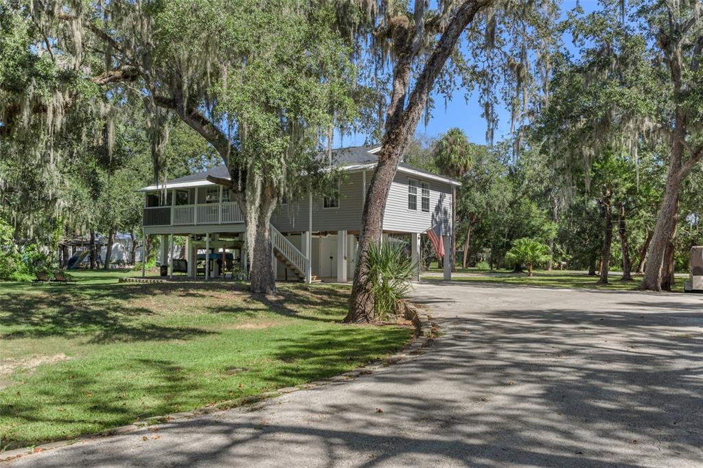 5890 South Mason Creek Road Homosassa, FL 34448 - Photo 6 of 50 a view of a house with a yard