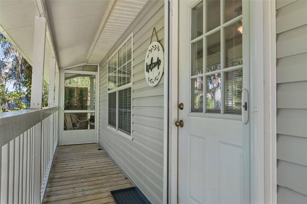 5890 South Mason Creek Road Homosassa, FL 34448 - Photo 8 of 50 a view of a door with wooden floor and windows