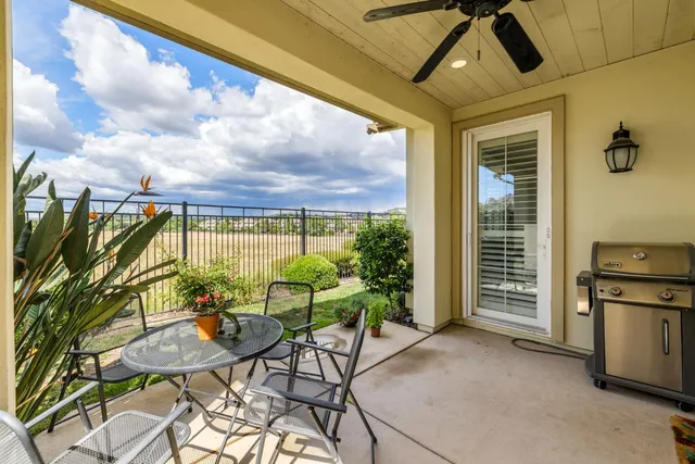 a view of a porch with furniture and yard
