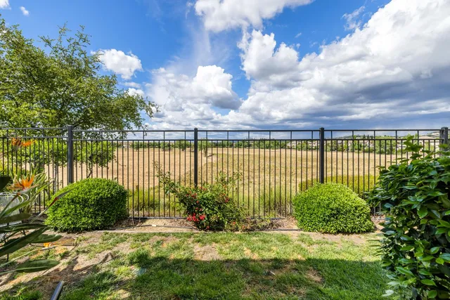 a view of a garden with a lake view