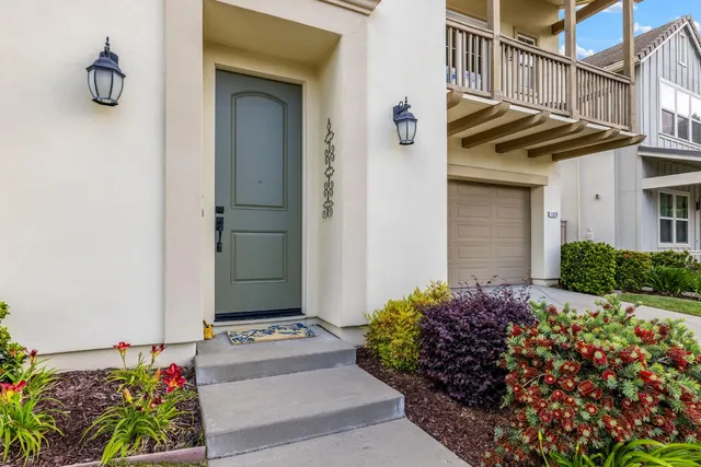 a view of a house with a flower garden