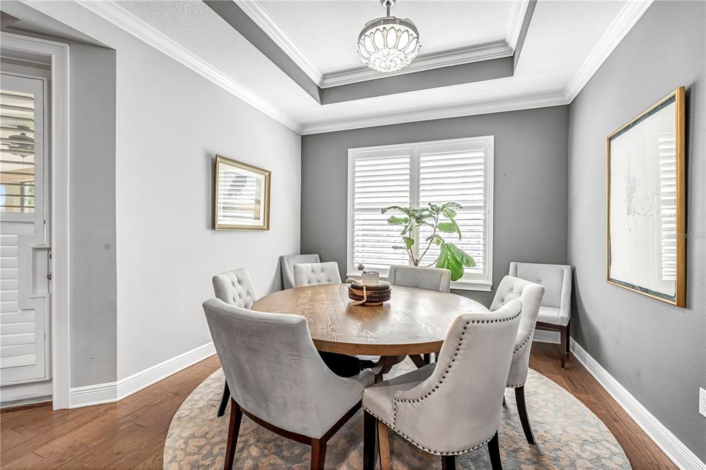 4081 Southern Valley Loop Brooksville, FL 34601 - Photo 15 of 64 a view of a dining room with furniture window and wooden floor