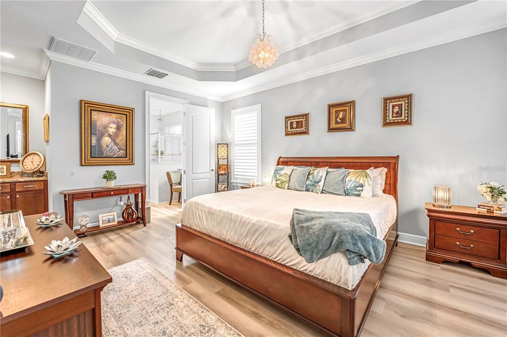 4081 Southern Valley Loop Brooksville, FL 34601 - Photo 22 of 64 a bedroom with a bed and wooden floor