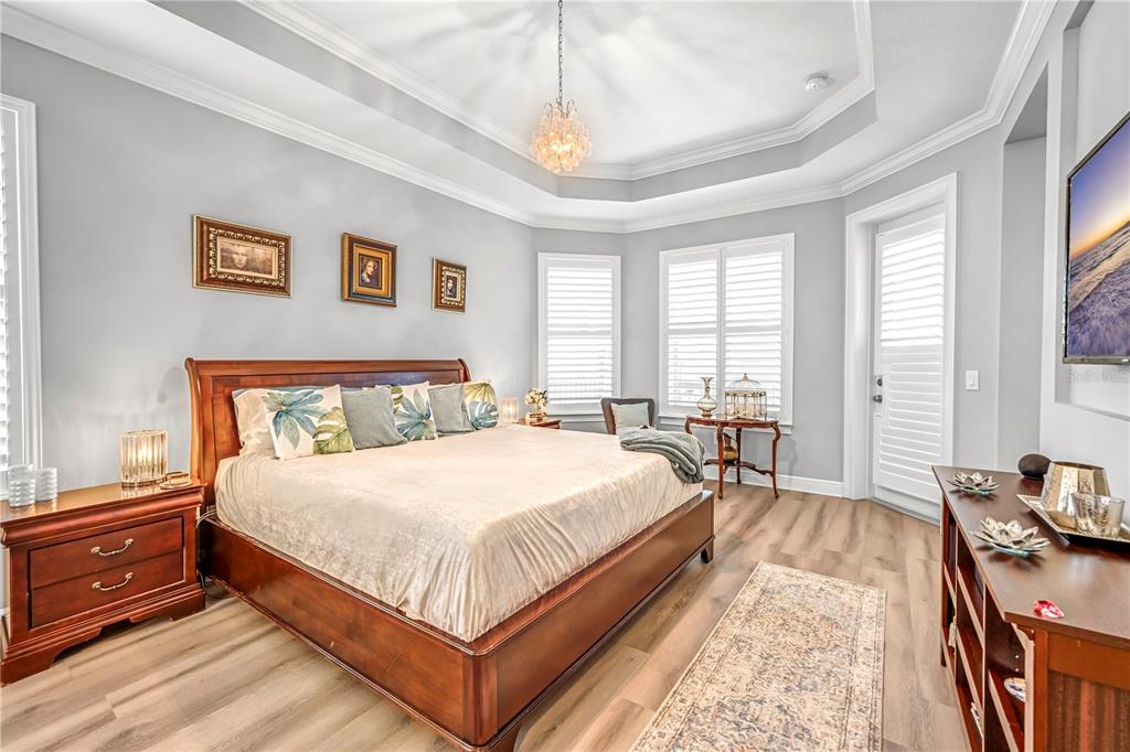 4081 Southern Valley Loop Brooksville, FL 34601 - Photo 23 of 64 a bedroom with a bed and wooden floor