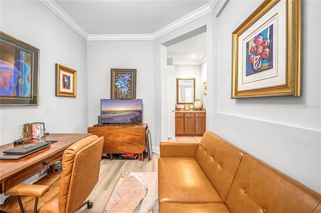 a spacious bedroom with a bed and a table in it