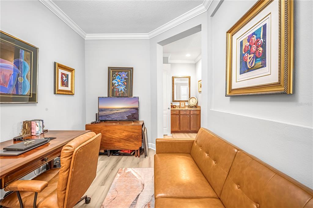 4081 Southern Valley Loop Brooksville, FL 34601 - Photo 25 of 64 a workspace with furniture and wall paintings