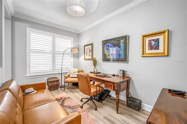 a bedroom with a bed and a dresser in it