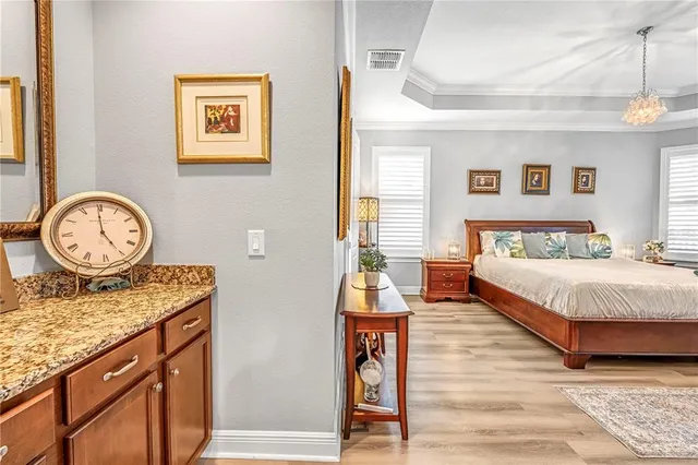 a kitchen with granite countertop a sink stove and refrigerator