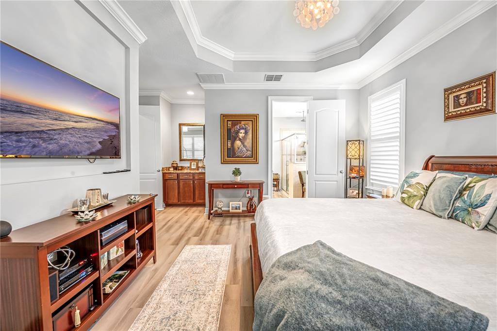 4081 Southern Valley Loop Brooksville, FL 34601 - Photo 28 of 64 a bedroom with a bed and a dresser in it