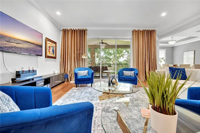 a view of a livingroom with furniture and staircase