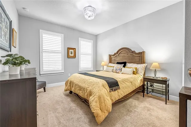 a view of a patio with table and chairs potted plants with wooden floor