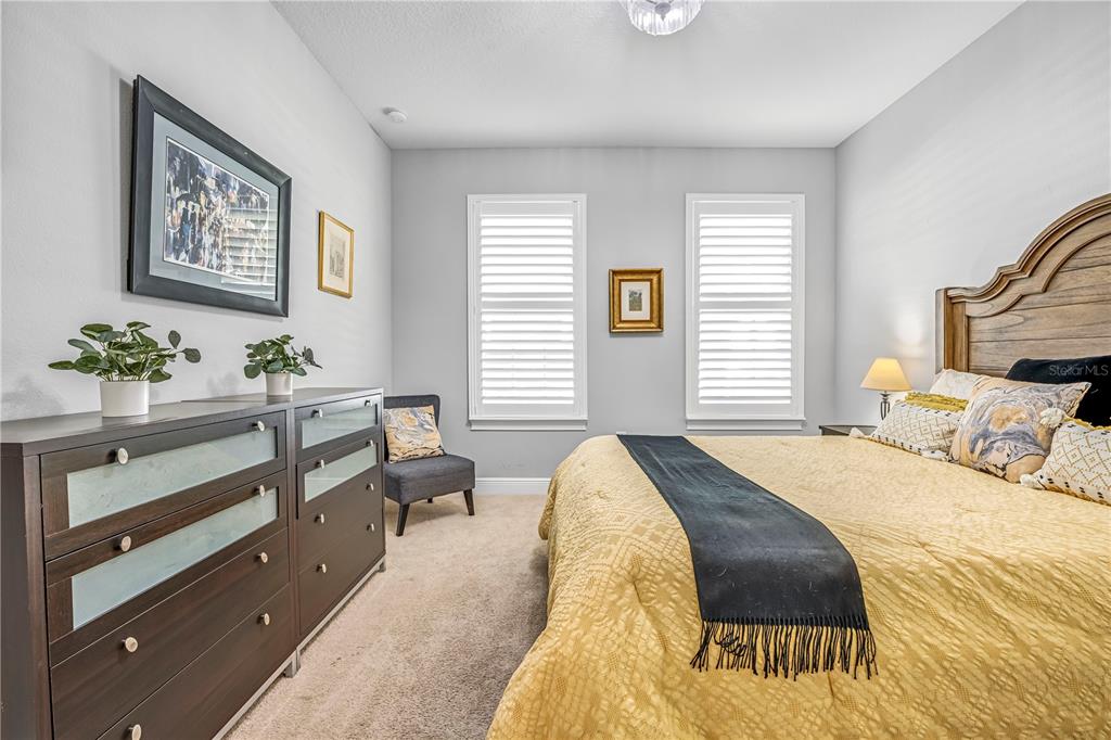 4081 Southern Valley Loop Brooksville, FL 34601 - Photo 32 of 64 a spacious bedroom with a bed and window