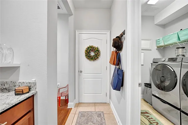 a balcony with wooden floor and outdoor seating
