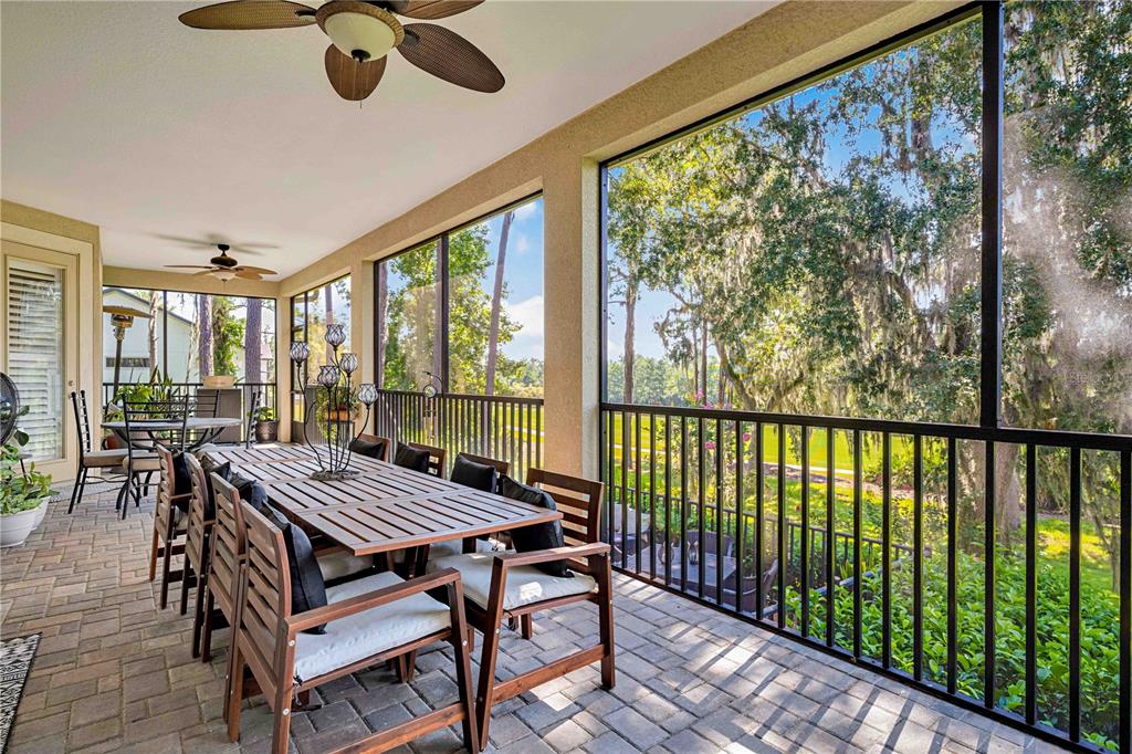 4081 Southern Valley Loop Brooksville, FL 34601 - Photo 40 of 64 a view of a patio with a table chairs and a patio