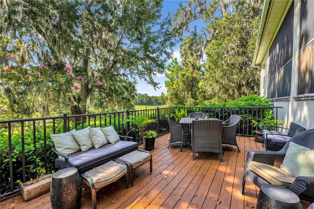 4081 Southern Valley Loop Brooksville, FL 34601 - Photo 42 of 64 a balcony with wooden floor and outdoor seating
