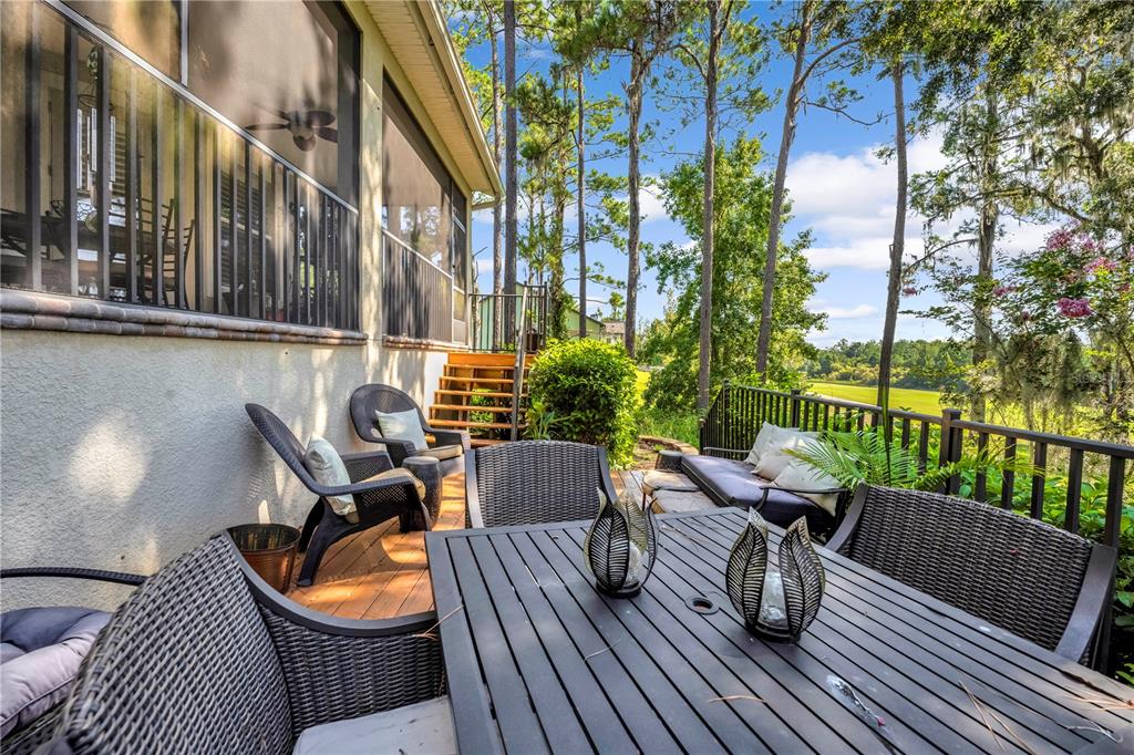4081 Southern Valley Loop Brooksville, FL 34601 - Photo 43 of 64 a balcony with wooden floor and outdoor seating