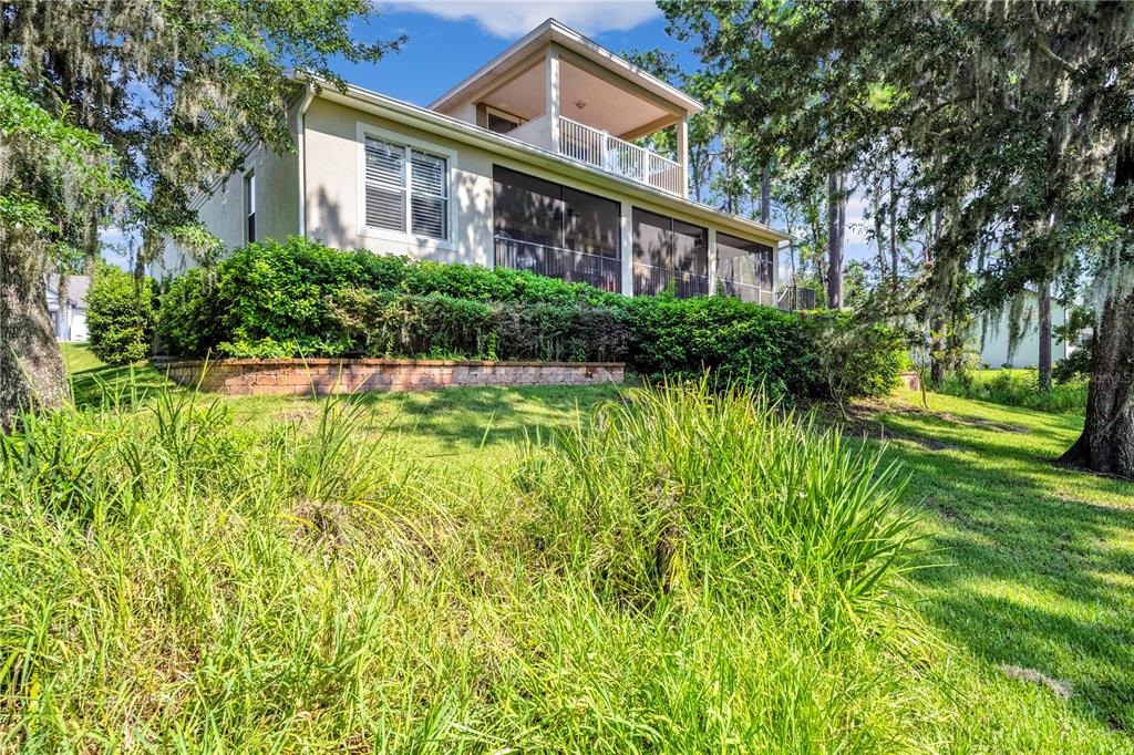 4081 Southern Valley Loop Brooksville, FL 34601 - Photo 50 of 64 a front view of a house with a yard