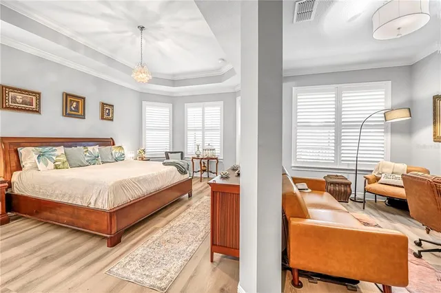 a dining room with stainless steel appliances kitchen island granite countertop a dining table chairs and view living room