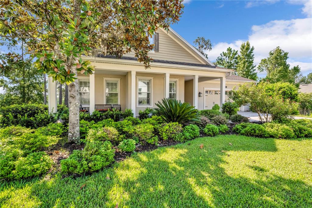 4081 Southern Valley Loop Brooksville, FL 34601 - Photo 63 of 64 a front view of a house with a yard