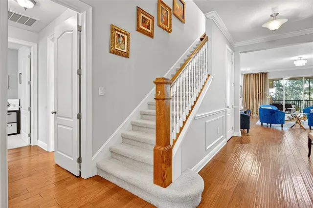 a living room with furniture and large windows