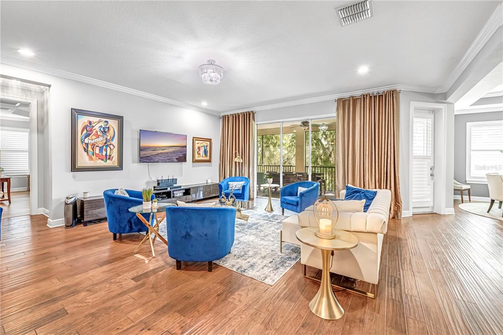 4081 Southern Valley Loop Brooksville, FL 34601 - Photo 10 of 64 a living room with furniture and large windows
