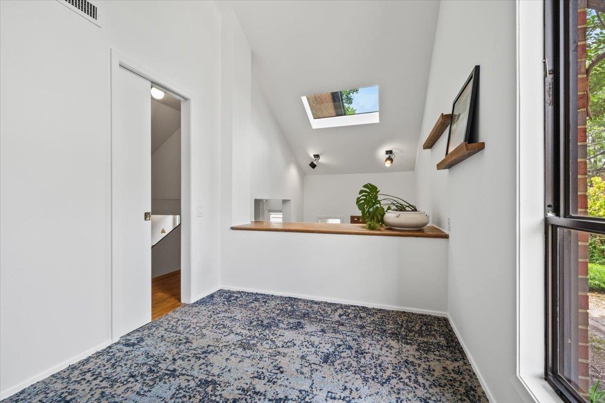 760 Roland Street Memphis, TN 38104 - Photo 14 of 29 a view of a hallway to rooms and stairs