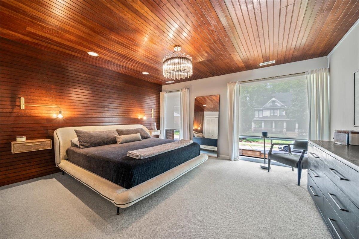 760 Roland Street Memphis, TN 38104 - Photo 15 of 29 a spacious bedroom with a bed and large windows