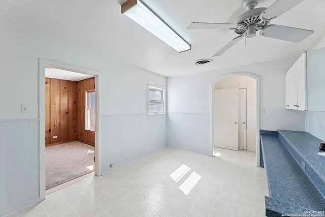 a kitchen with a sink a counter space appliances and cabinets
