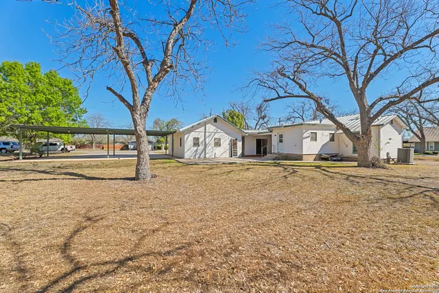 a house with trees in front of it