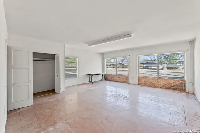 a bathroom with a sink a toilet and a shower