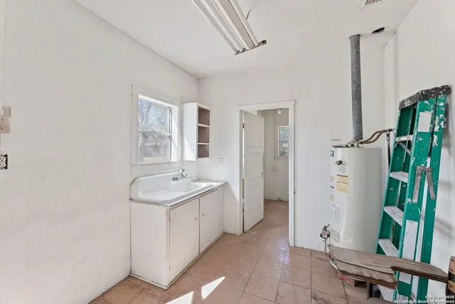 a bathroom with a toilet a sink and a mirror