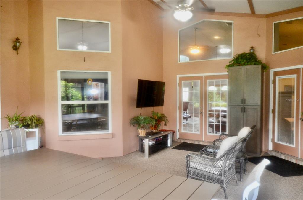 4708 Southwest 73rd Trail Lake Butler, FL 32054 - Photo 56 of 83 a living room with furniture and a flat screen tv