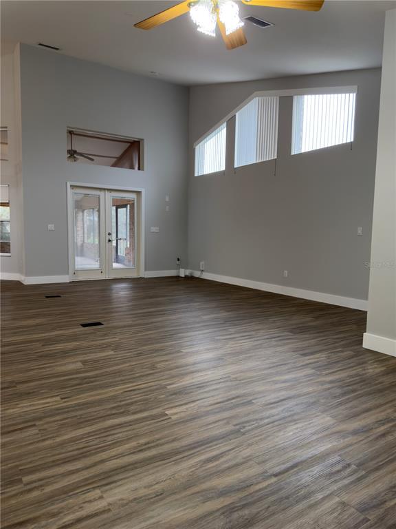 4708 Southwest 73rd Trail Lake Butler, FL 32054 - Photo 59 of 83 a view of an empty room with wooden floor and a window