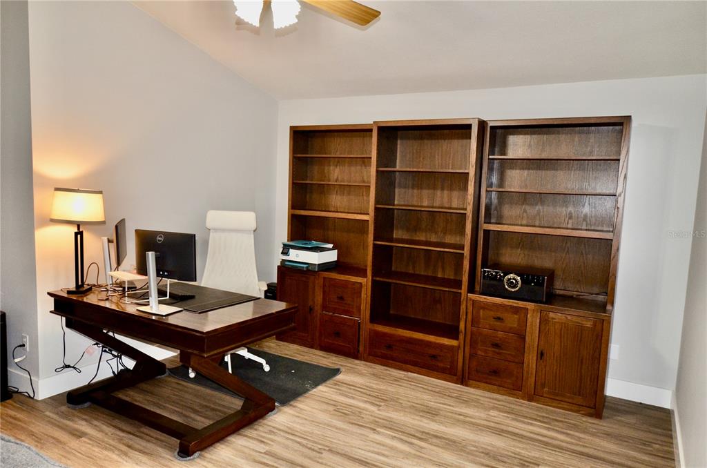 4708 Southwest 73rd Trail Lake Butler, FL 32054 - Photo 69 of 83 a view of a workspace with furniture and wooden floor