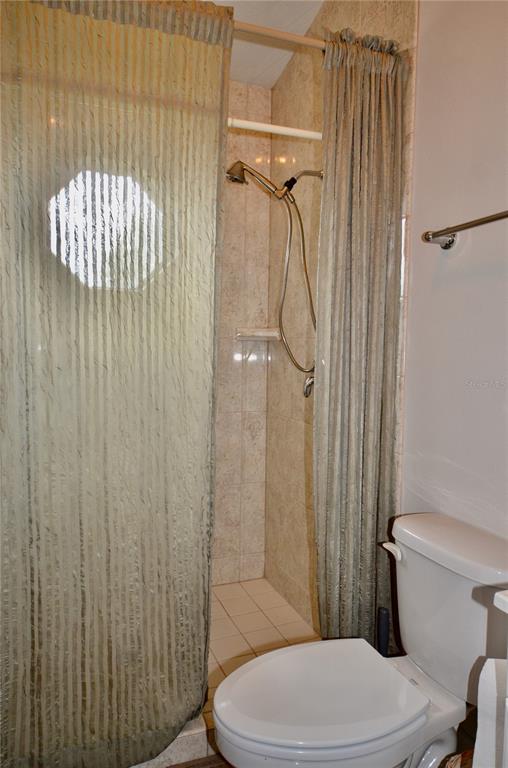 4708 Southwest 73rd Trail Lake Butler, FL 32054 - Photo 76 of 83 a white toilet sitting next to a shower curtain