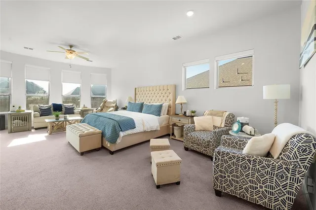 a living room with furniture and a lamp