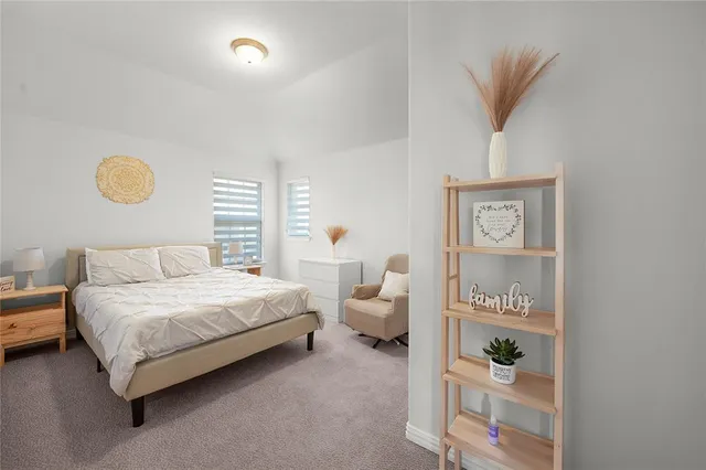 a bedroom with a bed and a cabinets