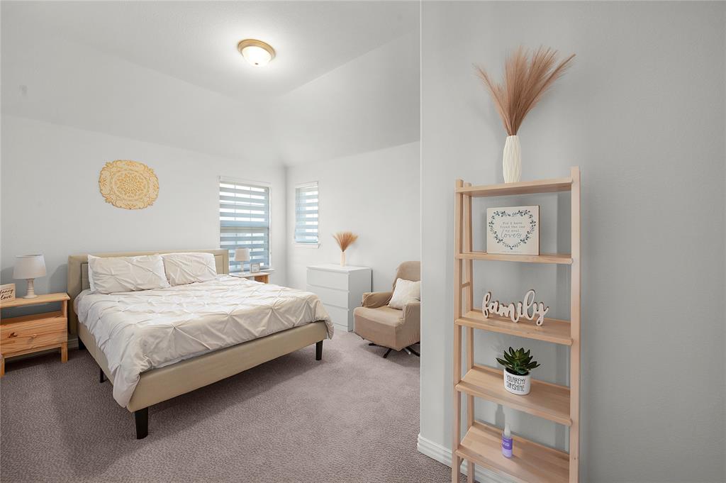 1510 Chisholm Trail Prosper, TX 75078 - Photo 20 of 32 a bedroom with a bed and a cabinets